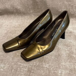 Vintage Stuart Weitzman gold patent leather square-toed pumps.